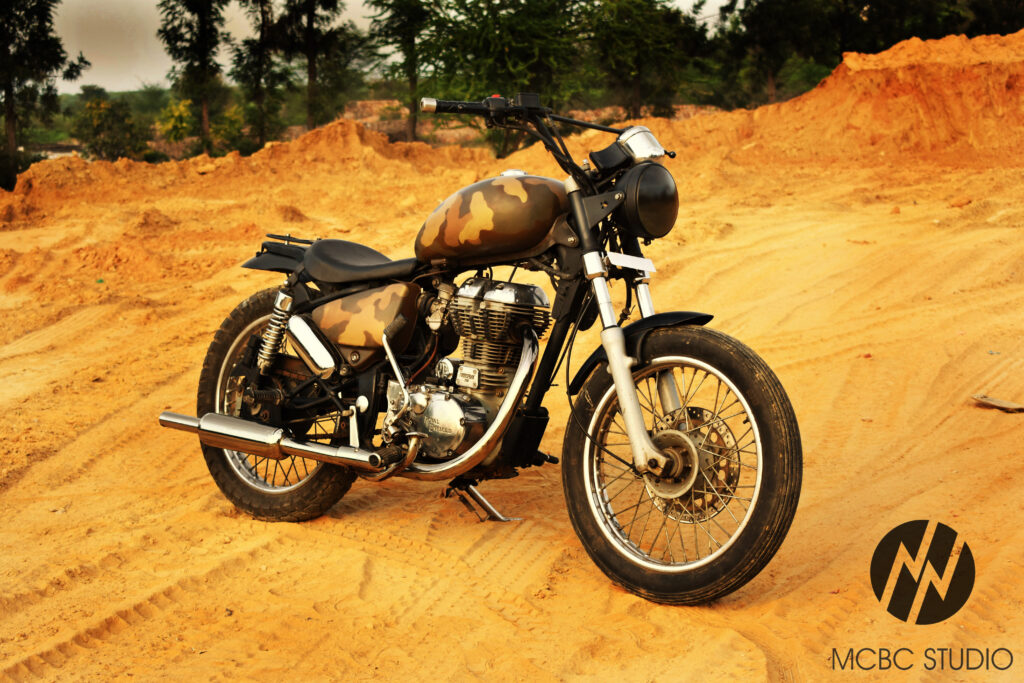 MCBC Studio custom modified motorcycle royal enfield bullet Thunderbird with a Khaki/desert camouflage paintjob along with custom seat and accessories